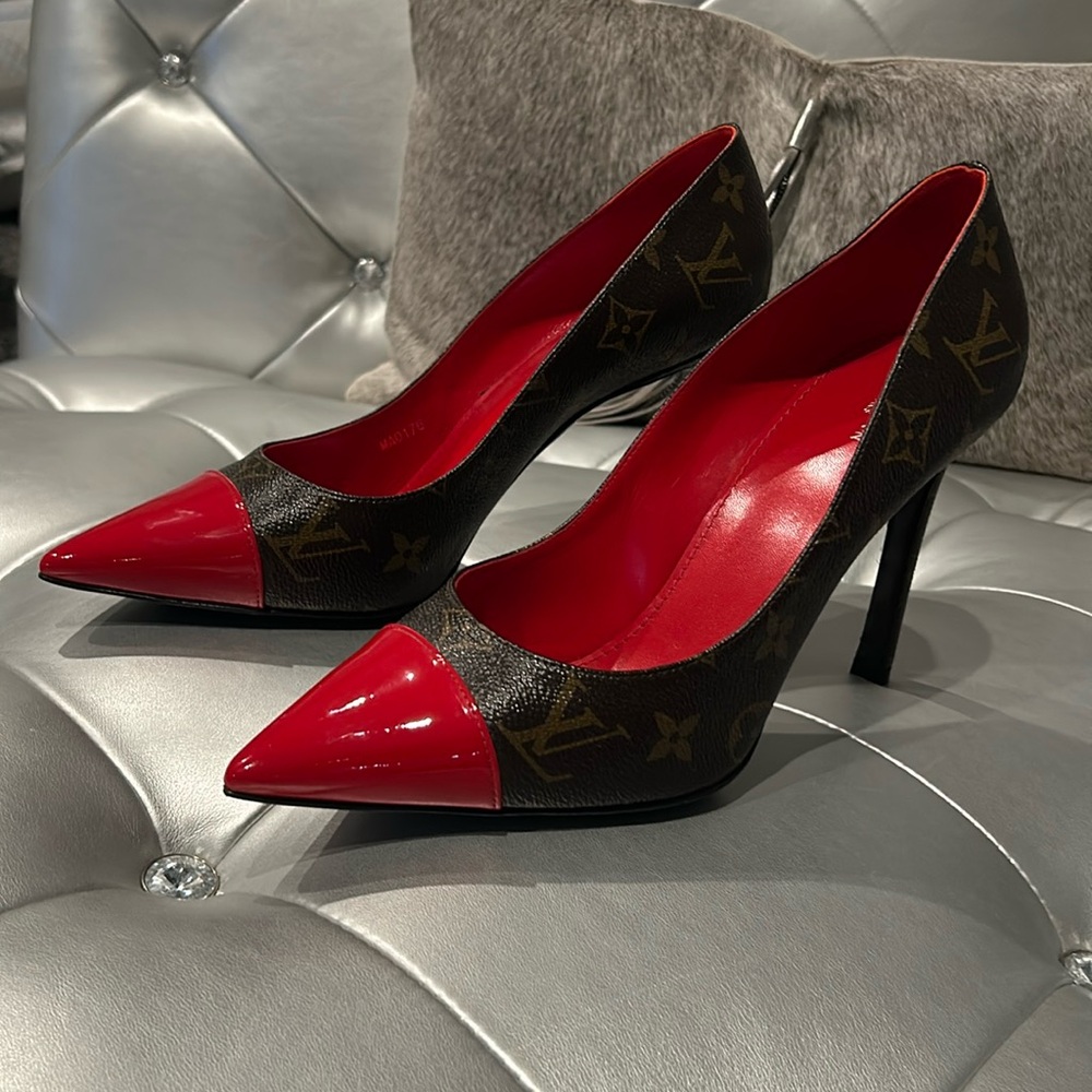 Louis Vuitton monogrammed pump with red patent toe.